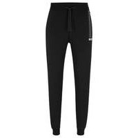 Cotton-terry tracksuit bottoms with dot stripes and logo, Hugo boss