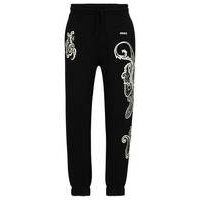 Cotton-terry tracksuit bottoms with paisley motif, Hugo boss