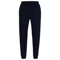 Relaxed-fit tracksuit bottoms with mirror-effect logo, Hugo boss