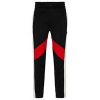 Relaxed-fit tracksuit bottoms with colour-blocking, Hugo boss