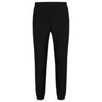 Tracksuit bottoms in stretch fabric with decorative reflective logo, Hugo boss