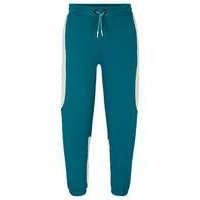 Baggy-fit tracksuit bottoms in stretch fabric, Hugo boss